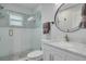 Clean bathroom with a walk-in shower, marble vanity, and modern fixtures at 510 25Th N Ave, St Petersburg, FL 33704