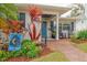 Welcoming front porch with brick walkway and vibrant plants at 510 25Th N Ave, St Petersburg, FL 33704