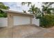 White garage door with driveway and gated entry at 510 25Th N Ave, St Petersburg, FL 33704