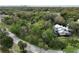 Aerial view of house and surrounding lot with trees at 5414 N River Shore Dr, Tampa, FL 33603