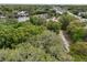 Aerial view of vacant lot with trees and road at 5414 N River Shore Dr, Tampa, FL 33603