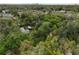 Overgrown property with small house visible from above at 5414 N River Shore Dr, Tampa, FL 33603