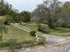 Landscaped front yard with driveway and mailbox at 5414 N River Shore Dr, Tampa, FL 33603