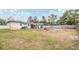 Large backyard with a mostly barren lawn at 5927 3Rd N Ave, St Petersburg, FL 33710