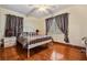 Spacious bedroom with wood floors and updated decor at 5927 3Rd N Ave, St Petersburg, FL 33710