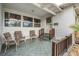 Front porch with two comfy chairs and a small table at 5927 3Rd N Ave, St Petersburg, FL 33710