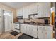 Efficient kitchen featuring white cabinets and built-in appliances at 5927 3Rd N Ave, St Petersburg, FL 33710