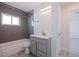 Clean bathroom with gray vanity and tile shower at 6025 Venetian Ne Blvd, St Petersburg, FL 33703