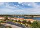 Aerial view of community with lake, fountain, and palm trees at 6291 Bahia Del Mar Cir # 702, St Petersburg, FL 33715