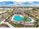 Aerial view of community pool with surrounding homes at 677 157Th E Ct, Bradenton, FL 34212