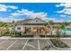 Community pool with cabana, grill, and ample lounge seating at 683 157Th E Ct, Bradenton, FL 34212