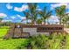Community entrance sign for Coddington with landscaping and palm trees at 683 157Th E Ct, Bradenton, FL 34212