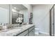 Bathroom with double vanity, granite countertop, and walk-in shower at 695 157Th E Ct, Bradenton, FL 34212