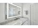 Bathroom features a vanity with granite countertop and modern fixtures at 7 Elgin Pl # 603, Dunedin, FL 34698