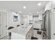 Modern kitchen with granite countertops and stainless steel appliances at 7 Elgin Pl # 603, Dunedin, FL 34698