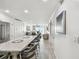 Open concept kitchen with granite countertops and stainless steel appliances at 7 Elgin Pl # 603, Dunedin, FL 34698