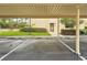 Reserved parking spaces under covered carport at 7540 Sunshine Skyway S Ln # 122, St Petersburg, FL 33711