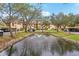 Landscaped courtyard with a central fountain at 7540 Sunshine Skyway S Ln # 122, St Petersburg, FL 33711