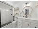 Clean bathroom with white vanity and frameless shower at 801 54Th S Ave, St Petersburg, FL 33705