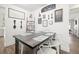 Charming farmhouse-style dining area with wooden table and white chairs at 801 54Th S Ave, St Petersburg, FL 33705