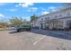 Exterior view of townhome with parking and landscaping at 8844 Christie Dr, Largo, FL 33771