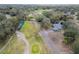 Aerial view of a house and surrounding area, including a park and golf course at 10308 Forest Hills Dr, Tampa, FL 33612