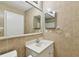 Bathroom boasts a vanity, large mirror, and tiled walls at 10308 Forest Hills Dr, Tampa, FL 33612