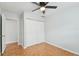 Bedroom with hardwood floors, double closets, and access to laundry at 10308 Forest Hills Dr, Tampa, FL 33612