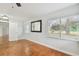 Bright bedroom with wood floors and view of backyard at 10308 Forest Hills Dr, Tampa, FL 33612