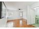 Bedroom with hardwood floors and bathroom access at 10308 Forest Hills Dr, Tampa, FL 33612