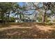 Ranch-style home with carport and large yard at 10308 Forest Hills Dr, Tampa, FL 33612