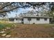 Gray house with large backyard and walkway at 10308 Forest Hills Dr, Tampa, FL 33612