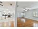 Open living room and kitchen with wood floors at 10308 Forest Hills Dr, Tampa, FL 33612