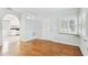 Living room with hardwood floors and kitchen view at 10308 Forest Hills Dr, Tampa, FL 33612
