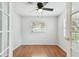 Small office or den with hardwood floors and French doors at 10308 Forest Hills Dr, Tampa, FL 33612