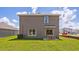 Two-story house with backyard patio and grassy area at 10828 Hidden Banks Gln, Parrish, FL 34219