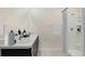 Bathroom boasts double sinks and a shower at 10873 Gentle Current Way, Parrish, FL 34219