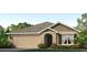 Single-story house with a two-car garage and landscaped yard at 10873 Gentle Current Way, Parrish, FL 34219