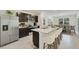 Modern kitchen with stainless steel appliances and an island at 10873 Gentle Current Way, Parrish, FL 34219