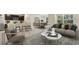 Open living area with a neutral color palette and comfy seating at 10873 Gentle Current Way, Parrish, FL 34219