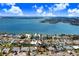 Home situated in a neighborhood near the water with bridges visible at 1145 Boca Ciega Isle Dr, St Pete Beach, FL 33706