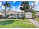 Charming single-story home with a well-maintained lawn and walkway at 1145 Boca Ciega Isle Dr, St Pete Beach, FL 33706