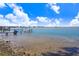 View of the waterfront with a damaged pier at 1145 Boca Ciega Isle Dr, St Pete Beach, FL 33706