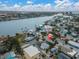 Aerial view of a house near the water, showing the surrounding neighborhood at 130 90Th Ave, Treasure Island, FL 33706