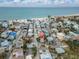 Aerial view of beach-close home and neighborhood at 130 90Th Ave, Treasure Island, FL 33706