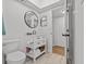 Simple bathroom with white vanity, toilet, and wood-look flooring at 1581 Amberlea S Dr, Dunedin, FL 34698