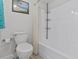 Bathroom with tub, shower, and neutral decor at 1581 Amberlea S Dr, Dunedin, FL 34698