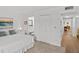 Main bedroom with en-suite bathroom and access to hallway at 1581 Amberlea S Dr, Dunedin, FL 34698