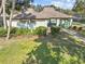 Community clubhouse with Piper's Glen signage at 1581 Amberlea S Dr, Dunedin, FL 34698