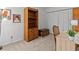 Bright home office features built-in shelving and wood desk at 1581 Amberlea S Dr, Dunedin, FL 34698